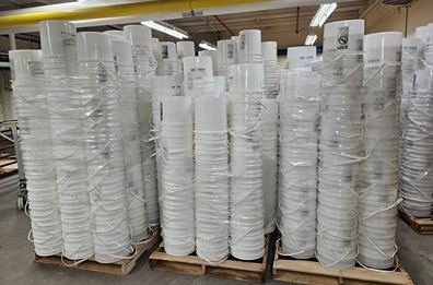 Pallets of wholesale 5-gallon buckets stacked in the USA Buckets warehouse